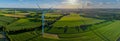 Panorama aerial view of countryside with windmills and agriculture fields. Landscape with corn, grain, maize fields and different