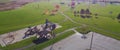 Panorama aerial view empty parking space at community recreational center with playground, huge grassy baseball field and colorful