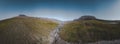 Panorama aerial view of a hiking area in a rocky environment with arctic meadows in summer. River on Island of kuannit