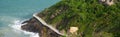 Panorama aerial view timber boardwalk built over rocks mountain side by the ocean with tourist walking, elevated walkway viaduct Royalty Free Stock Photo