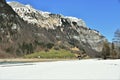 Panorama of Alps with KlÃÂ¶ntalersee lake in the foreground covered with snow in early spring sunny day in KlÃÂ¶ntal