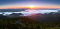 Panorama with amazing sunrise. Landscape with high mountains. Fields and meadow are covered with morning fog and dew. Touristic Royalty Free Stock Photo