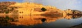 Panorama of Amber Fort reflected in Maota Lake near Jaipur, Rajasthan, India. Royalty Free Stock Photo