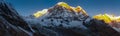 Panorama of the Annapurna South peak partially sunlit at sunrise