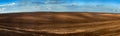 Panorama of arable land over amazing clouds sky Royalty Free Stock Photo