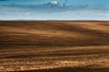 Panorama of arable land over clouds sky Royalty Free Stock Photo