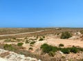 Panorama of an arid and barren island with little vegetation