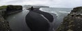 Panorama of Arnardrangur rock in the middle of peninsula near Reynisfjara Beach view point Dyrholaey in very bad weather