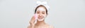 Happy laughing young asian woman washing face with foam soap cosmetic product. Web banner Royalty Free Stock Photo