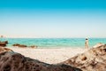 Panorama attractive caucasian tourist woman in white bikini walk on white sand beach alone explore middle east.Persian gulf