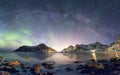 Panorama of Aurora borealis with Milky way galaxy over snow mountain in coastline