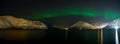 Panorama of Aurora polaris above a lake Royalty Free Stock Photo