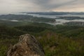 Panorama of the Avacha Bay with two ships on water and coast with hills covered by forest and volcano Vilyuchik also