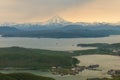 Panorama of the Avacha Bay with two ships on water and coast with hills covered by forest and volcano Vilyuchik also