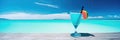 Panorama banner of cocktail on an exotic beach on a sunny day with clear turquise water and blue sunny sky Royalty Free Stock Photo