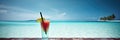 Panorama banner of cold cocktail on an exotic beach on a sunny day with clear turquise water and blue sunny sky Royalty Free Stock Photo