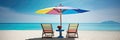 Panorama banner of two chairs and a sun umbrella on an exotic beach on a sunny day with clear turquoise water and blue sunny sky Royalty Free Stock Photo