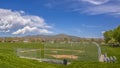 Panorama Baseball or Softball field with bleachers outside the safety fence