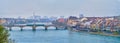 Panorama of Basel cityscape with Mittlere Brucke bridge and historical riverside houses on bank of Rhine river, Switzerland