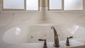 Panorama Bathroom interior of a home with polished bathtub and frosted windows