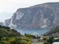 Bay with rocks and yellow brooms to Ponza in Italy. Royalty Free Stock Photo