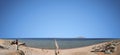 panorama of the beach in Egypt with a view of the pier and the island of Tiran. People relax on vacation