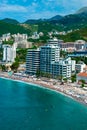 Panorama of the beach and the resort towns of Becici and Rafailovici, located at the foot of the mountains. Montenegro