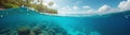 panorama of a beach resort and underwater world at the same time, dividing the image into upper and lower parts by a wave Royalty Free Stock Photo
