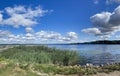 Panorama of beautiful blue sky with cumulus clouds over Kisezers lake Royalty Free Stock Photo