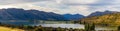 Pano Beautiful sunset Mountain range of the Southern Alps, Lake Wanaka, at Dublin Bay, in Wanaka, Otago, South Island, New Zealand Royalty Free Stock Photo