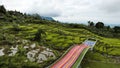 panorama of beautiful countryside of bogor. sunny morning. wonderful springtime landscape in mountains. grassy field and rolling Royalty Free Stock Photo