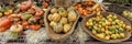 Panorama of Beautiful and different varieties of squashes and pumpkins on rustic cork basket. Autumn rustic scene. Selective focus