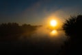 Panorama of beautiful misty lake coast at sunrise moment Royalty Free Stock Photo