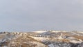 Panorama Beautiful natural scenery with houses nestled on top of snow covered hills Royalty Free Stock Photo