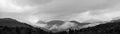 Panorama of a beautiful scenery of misty mountains