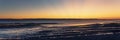 Panorama of beautiful sunset over the rocky coast Royalty Free Stock Photo