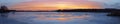 Panorama of the beautifull sunset over icy river