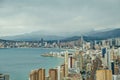 Panorama of Benidorm city skyline with Mediterranean sea and mountains in the background