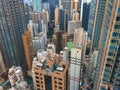 Panorama of the big city from height of bird`s flight, multi-colored skyscrapers and roofs of houses the top view, the modern city