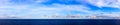 Panorama Blue sea and blue sky with white cloud. Royalty Free Stock Photo