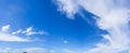 Panorama blue sky horizontal with beautiful cirrocumulus clouds in bright clear summer season, good weather for out door activity