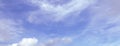 Panorama of blue sky with light clouds, wide view, good weather concept, classic background