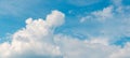 Panorama of blue sky with white fluffy clouds