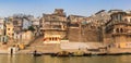 Panorama of boats and historic buildings at the Babua Pandey Ghat in Varanasi