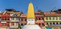 Panorama of the Boudhanath stupa in front of colorful houses in Kathmandu