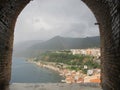 Scenic view of the small Italian city of Scilla on the sea coast and mountains in the fog on the sea coast from an ancient fortres