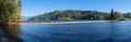 Panorama of the bright orange boom and the dam at the Merwin Reservoir near Ariel, Washington, USA Royalty Free Stock Photo