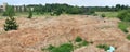 Panorama of a building landfill in a forest glade. Royalty Free Stock Photo