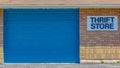 Panorama Building with pitched roof and large blue door viewed on a sunny day Royalty Free Stock Photo