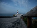 Panorama of Cabo Ortegal lighthouse on steep rocky cliff atlantic ocean bay of biscay Carino Cape Galicia Spain